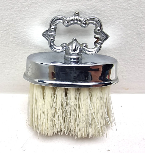 Ornate chrome handheld clothes - handheld,